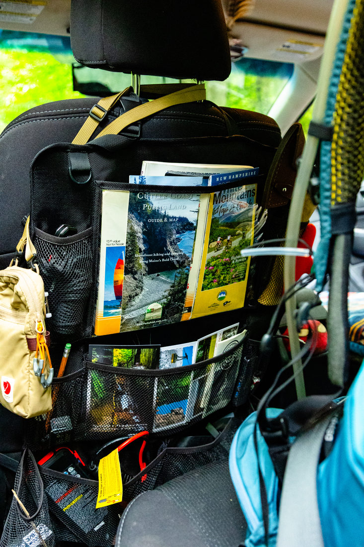 Trail maps and guides tucked into a seat organizer